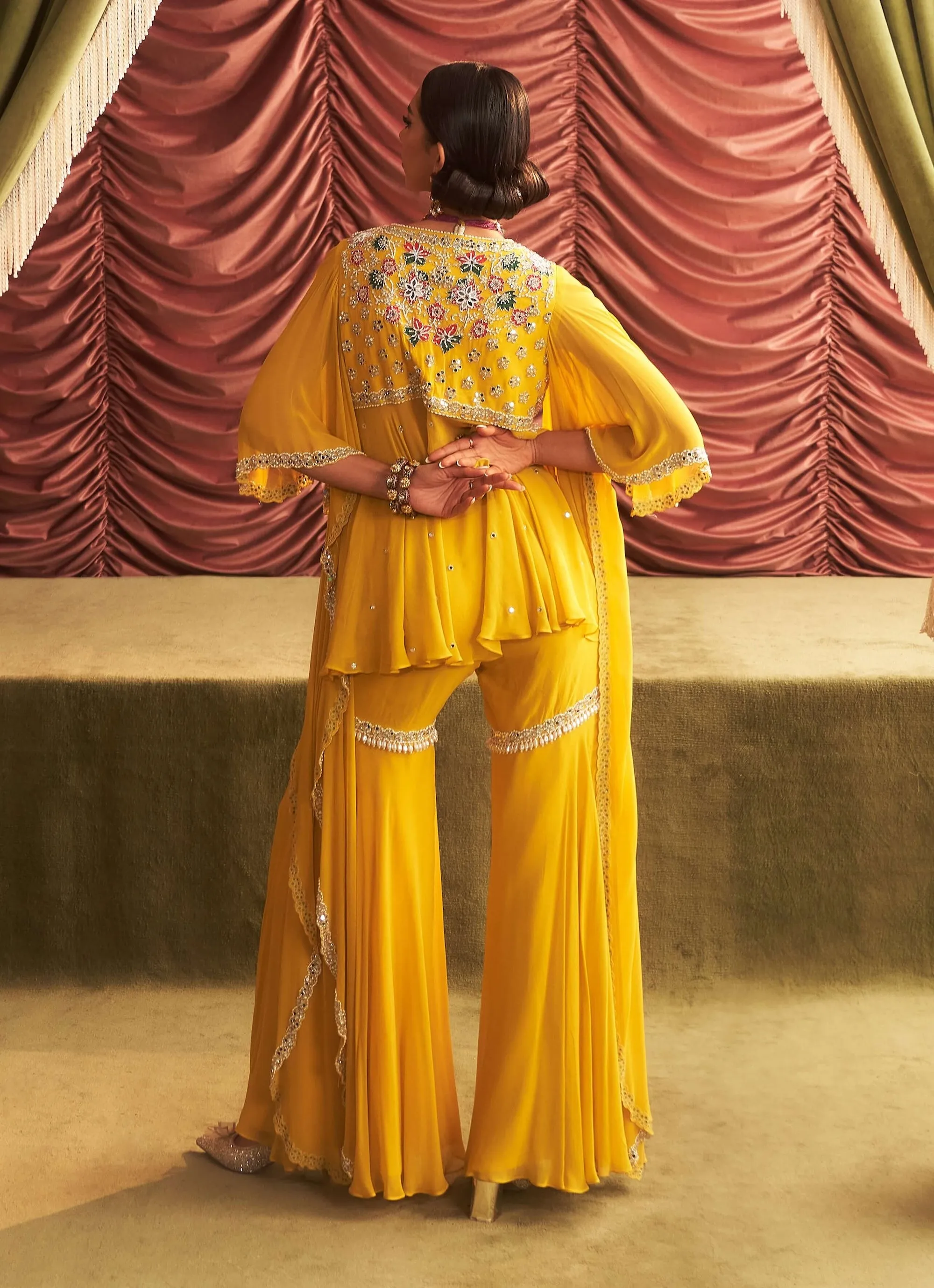 Jyoti yellow embellished peplum and gharara pants